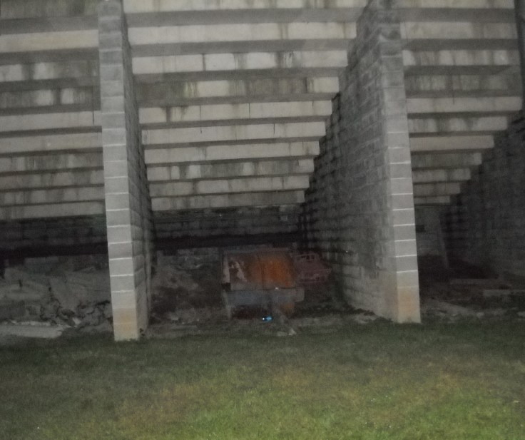 Under the football field bleachers